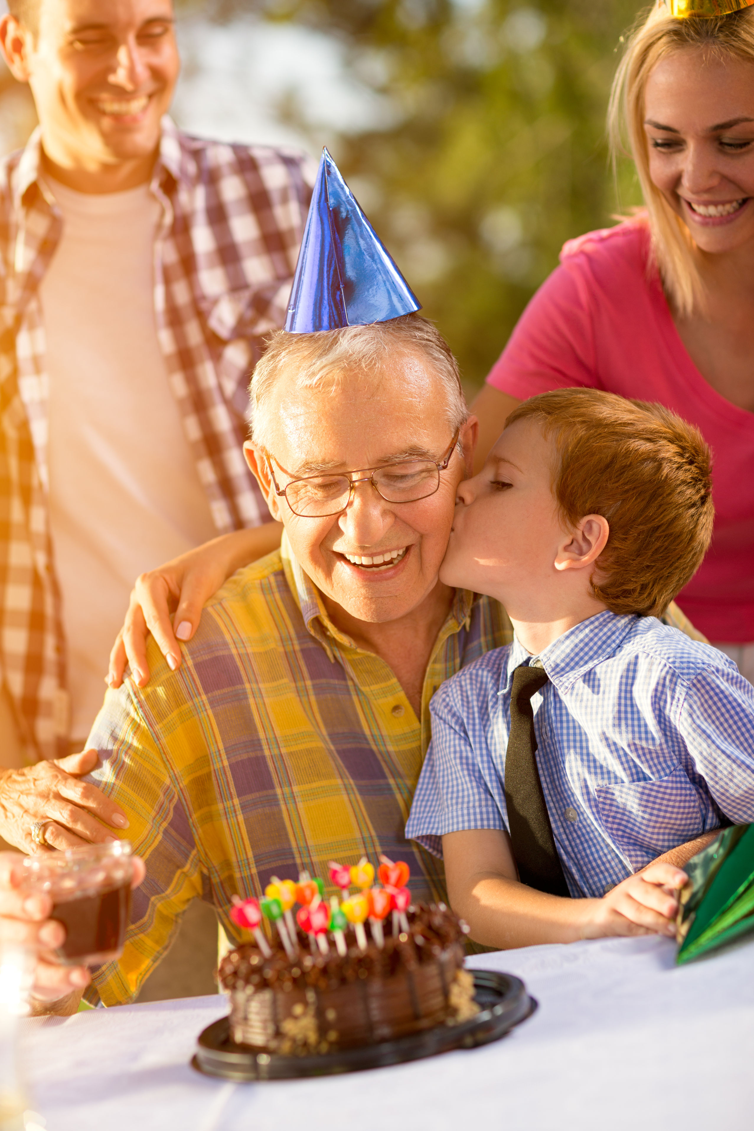 64540803 - portrait of grandfather and grandson celebrating birthday